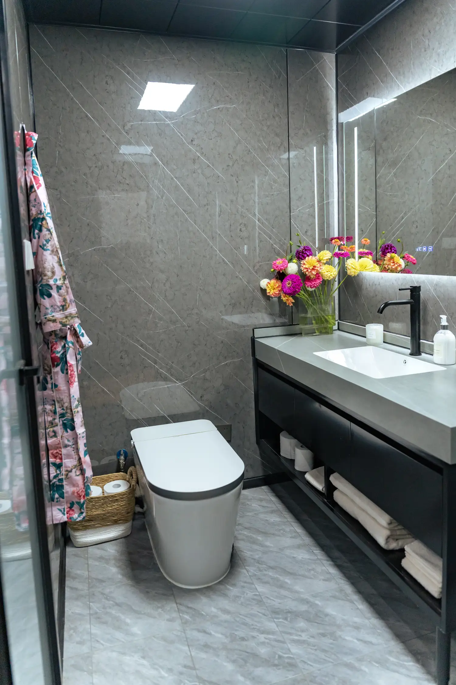 Full bathroom with marble vanity and shower